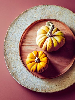 photo of two small pumpkins on a wooden platter
